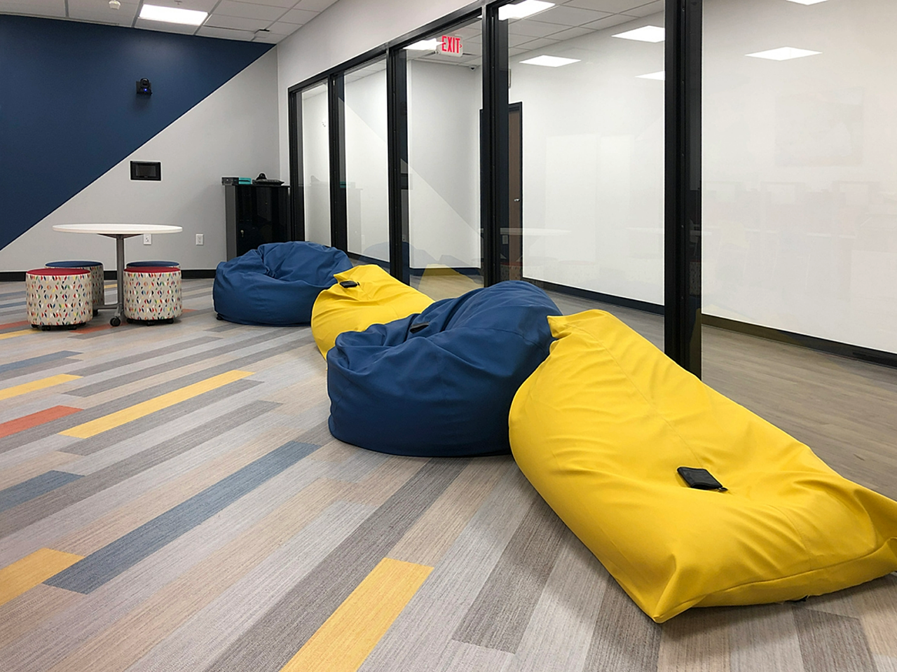 Colorful bean bag chairs offer a comfy seating option in the youth room.