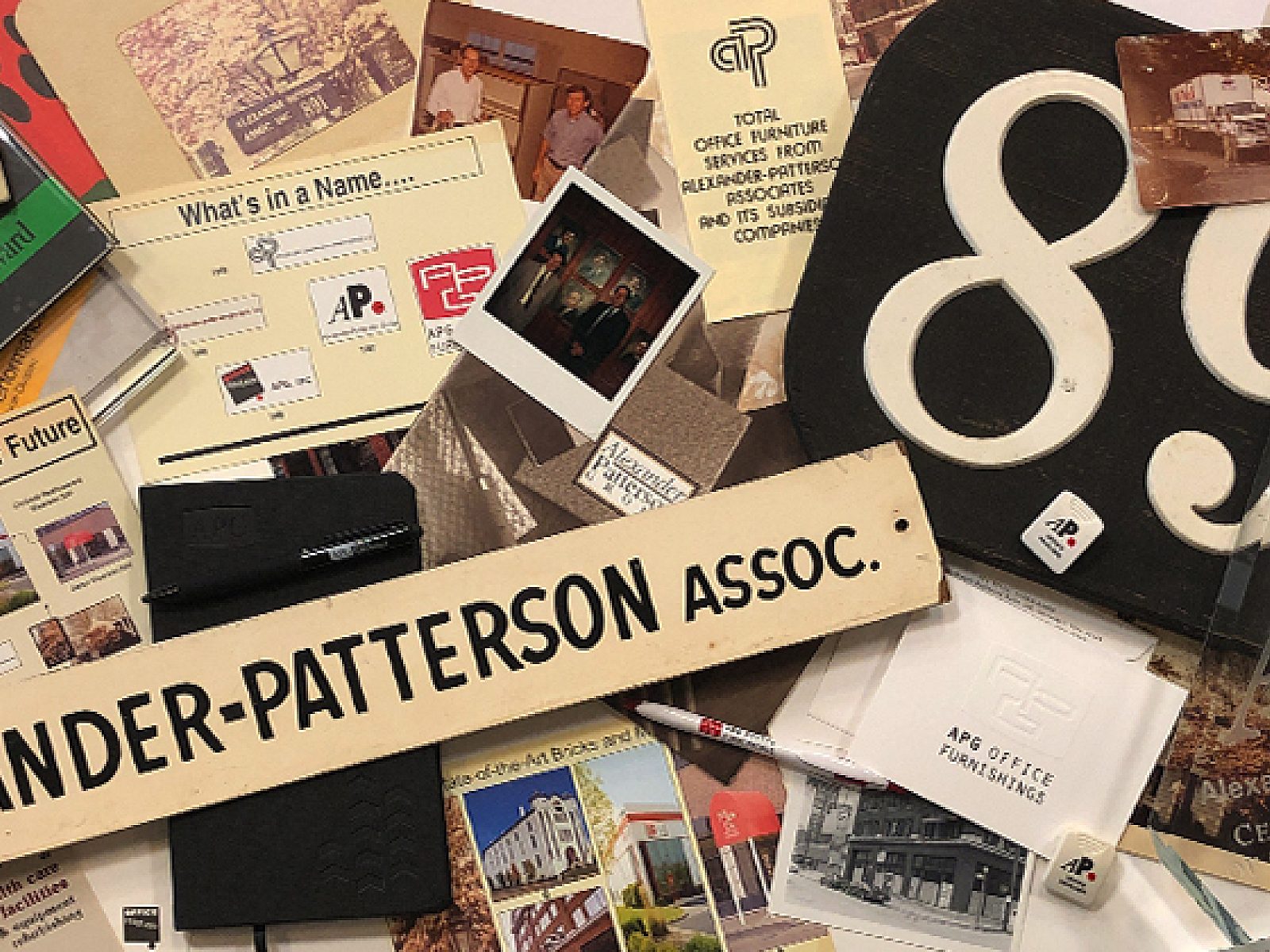Flat-lay collage of APG memorabilia from the archive: historic photos, promotional materials, brochures, awards, signage.