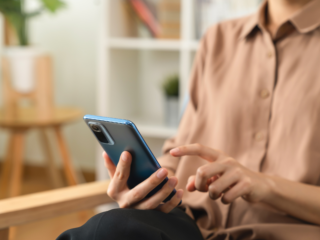 Person using a smartphone to make a call or compose a message