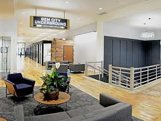 A clean and modern office lobby featuring sleek furniture and bright lighting, creating a welcoming atmosphere.